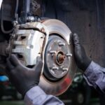 A,Mechanic,At,A,Car,Service,Diagnoses,And,Replaces,The