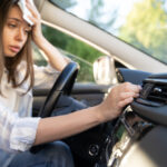 Girl,Driver,Has,Problem,With,A,Non-working,Conditioner,,Hand,Checking