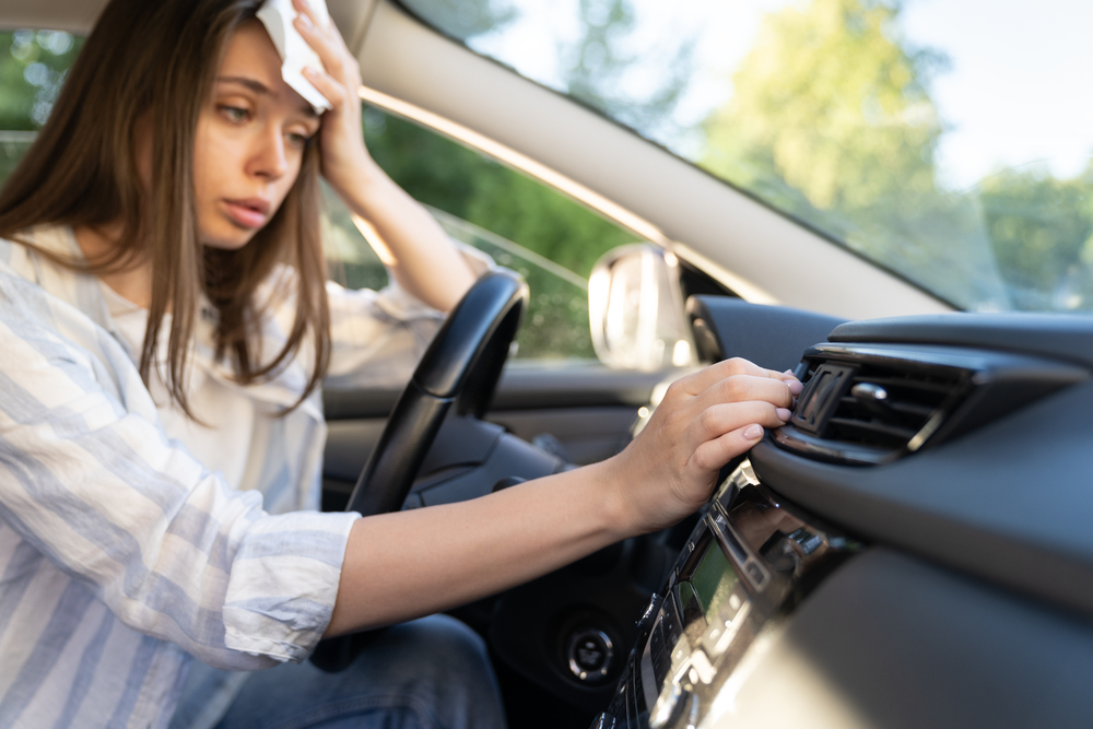 Girl,Driver,Has,Problem,With,A,Non-working,Conditioner,,Hand,Checking
