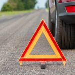 Car,Breakdown,On,Side,Of,Road,With,Warning,Triangle.,Emergency